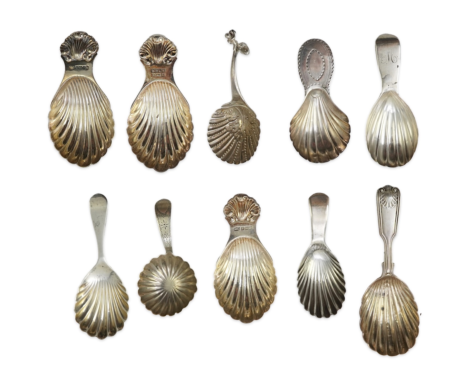 Ten assorted 19th and 20th century silver caddy spoons, with shell or fluted bowls